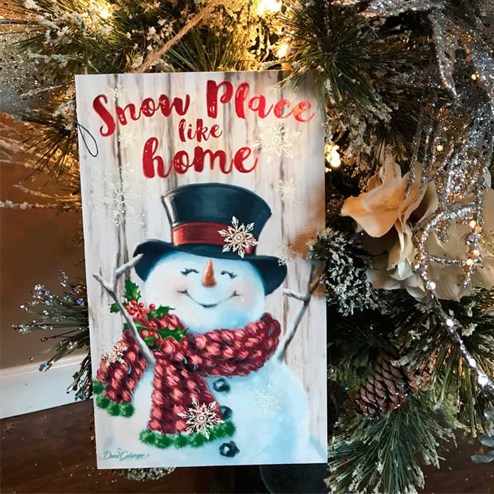  This charming art piece features a cheerful snowman with his arms spread wide and head lifted up, exuding a sense of contentment and happiness.