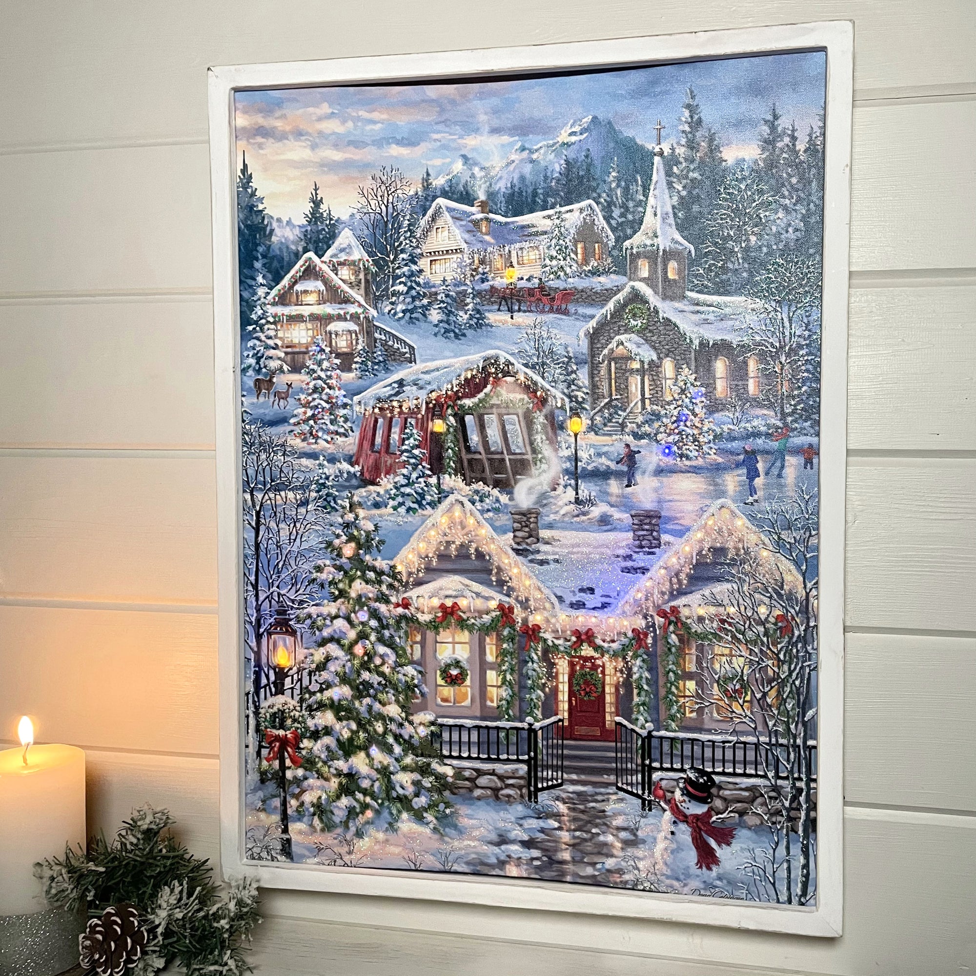  Immerse yourself in the enchanting scene of a snowy village, complete with ice skaters gliding gracefully across a frozen pond, a majestic red horse drawn carriage, a charming covered bridge, and a picturesque chapel nestled among multiple twinkling Christmas trees.