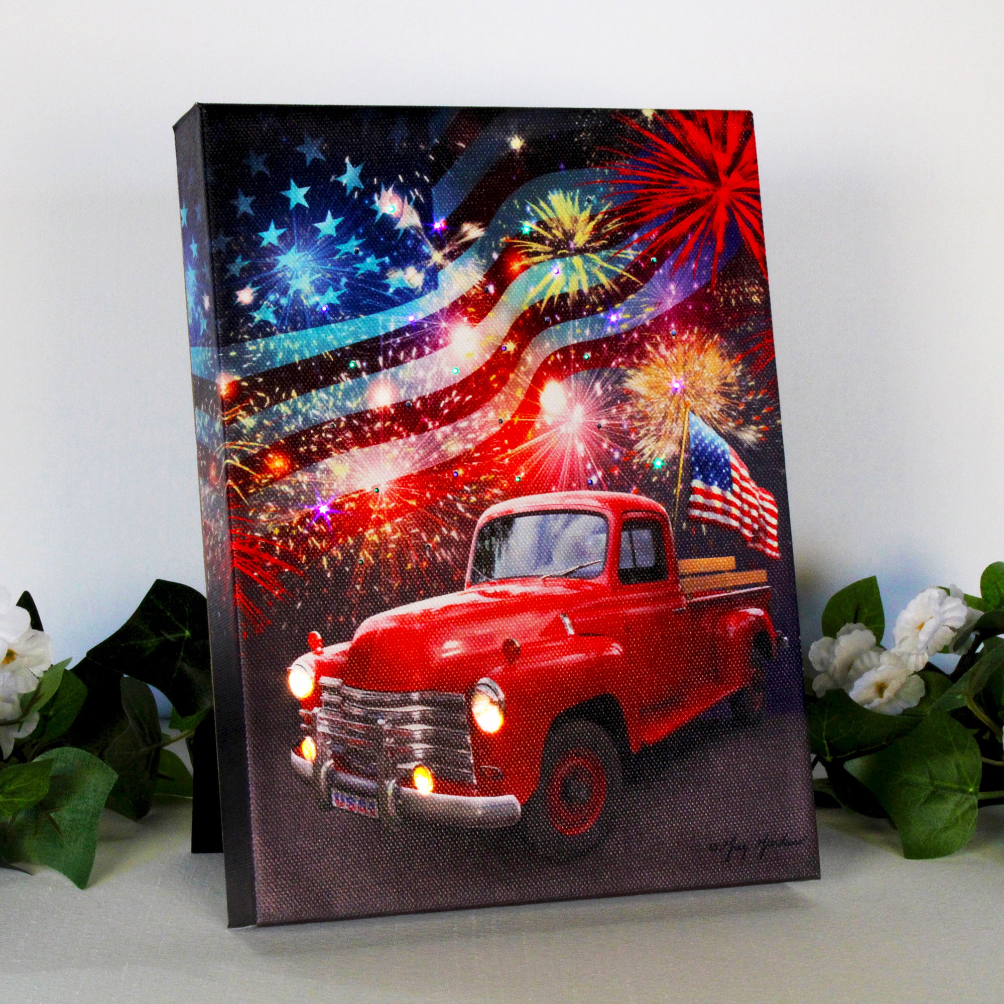 This stunning canvas captures the essence of a patriotic summer evening, with an old fashioned red truck parked proudly and an American flag waving triumphantly in the bed of the truck.  As you gaze at the canvas, the colorful fireworks burst to life in a dazzling display of love and passion.