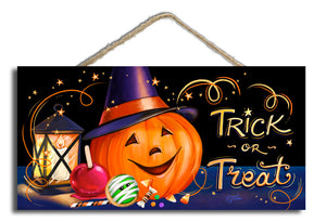 Featuring a charming jack-o-lantern wearing a witch's hat, the sign is accented by a glowing lantern, a candy apple, a cookie, and an array of tempting candies. "Trick or Treat" is emblazoned in bold letters, inviting all ghouls and goblins to partake in the festive fun.