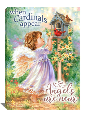 Angels are Near Canvas Wall Art. This enchanting piece features a young angel gazing fondly at two cardinals perched on a quaint birdhouse