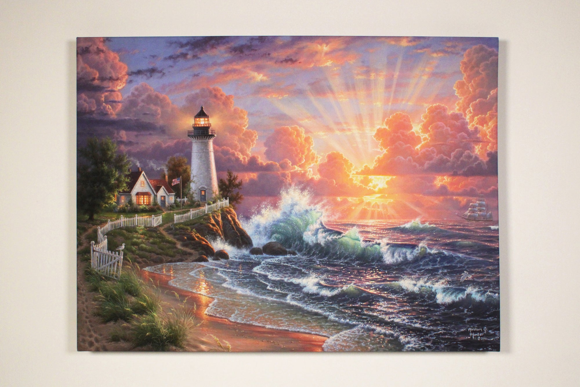 This stunning canvas captures the romantic scene of a majestic lighthouse perched atop a rugged cliff, overlooking the glistening sea. The charming house and the fluttering American flag add to the patriotic aura of the setting.  As you follow the winding trail down to the beach, you'll be mesmerized by the soothing sound of waves crashing against the shore. The setting sun streams through the clouds, creating a warm and inviting atmosphere that's sure to set your heart aflutter.