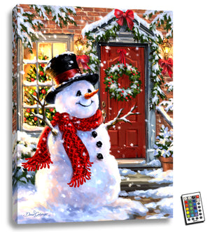 This enchanting piece features a delightful snowman adorned in a cozy scarf and top hat, standing in front of a charming house with a cheerful red door. The wreath on the door and twinkling Christmas tree seen through the window add to the festive atmosphere.