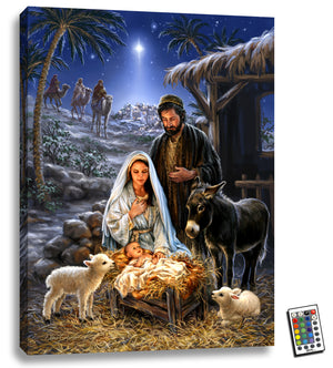 This stunning 18x24 piece of art features Mary, Joseph, and the farm animals gathered around the newborn baby Jesus, bathed in the warm glow of fully illuminated LED lights.