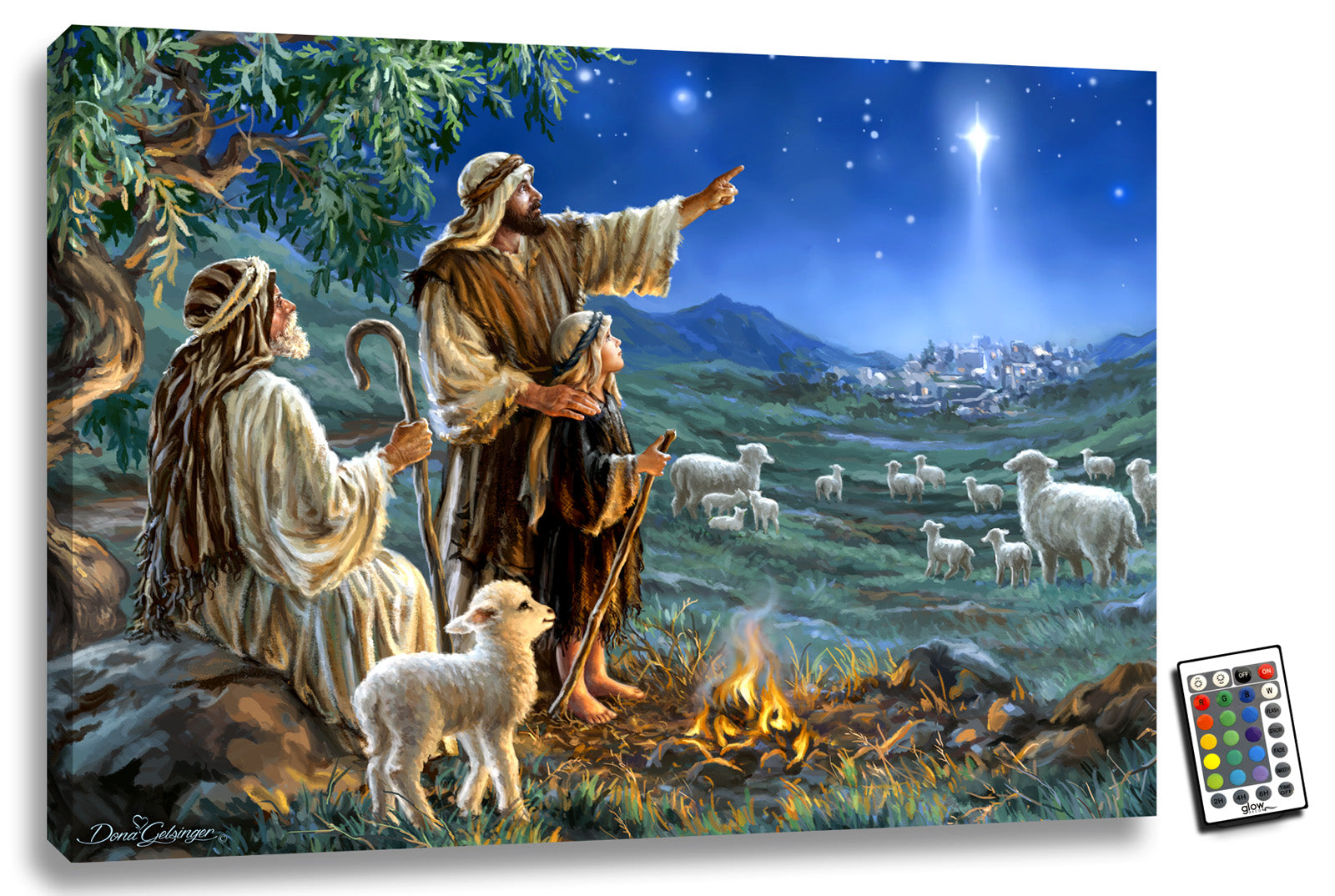 This stunning piece features three generations of shepherds gathered around a cozy fire, with a sweet lamb by their side. As they tend to their flock in the peaceful countryside, one of the wise shepherds points towards a shining star that illuminates the night sky, leading the way to the birthplace of Jesus.