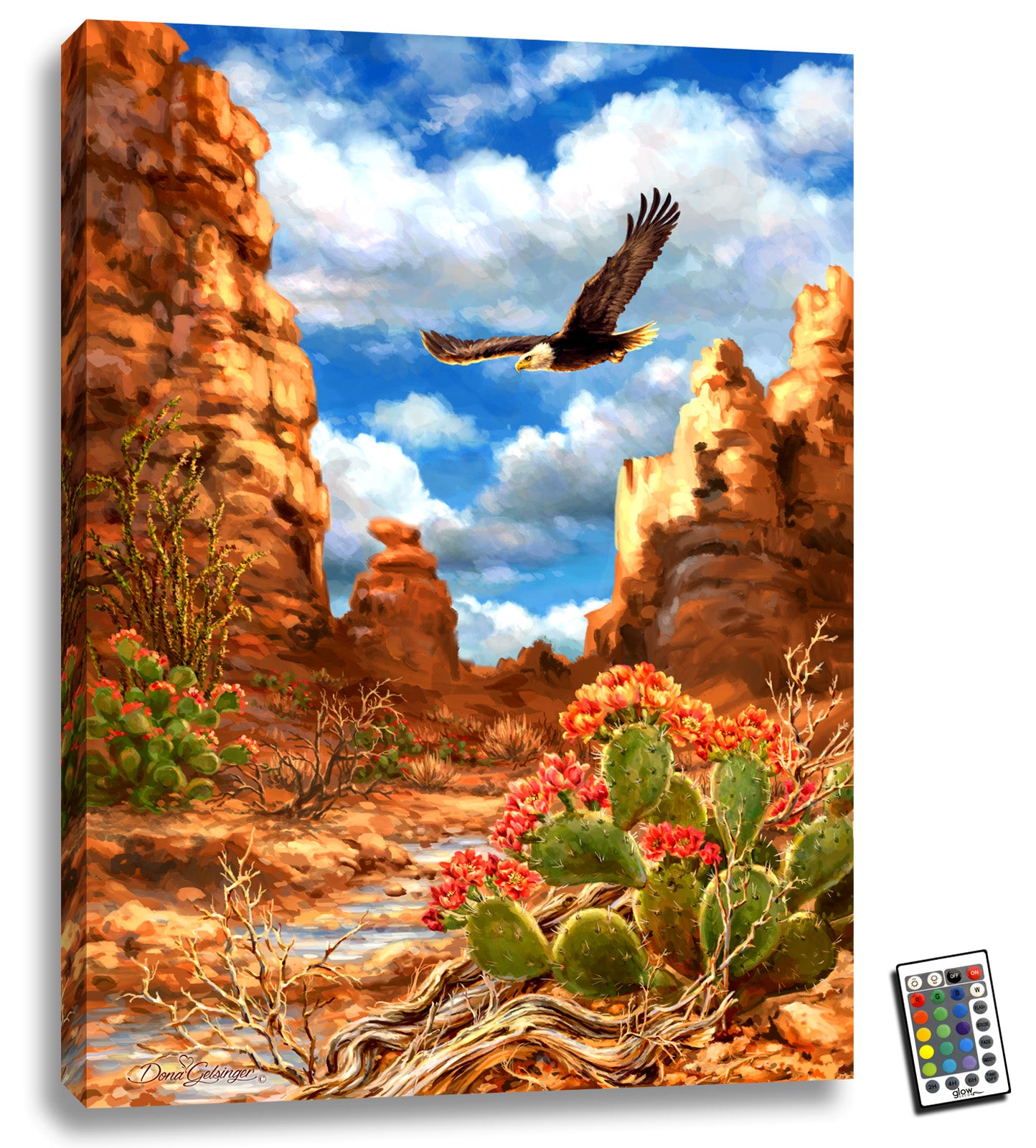  This stunning piece features a captivating scene of a blooming cactus stand set against a majestic canyon of plateaus. As you gaze upon this mesmerizing landscape, you'll feel transported to the heart of the desert, surrounded by the raw, rugged beauty of nature.  But that's not all - as you take in the scene, a magnificent bald eagle soars through the canyon