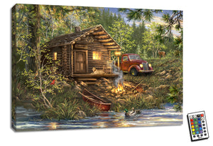  This charming piece features a picturesque scene of a little cabin nestled among the trees, complete with an old-fashioned red truck parked nearby, a loyal golden retriever, a crackling campfire, and a serene canoe waiting by the water's edge.