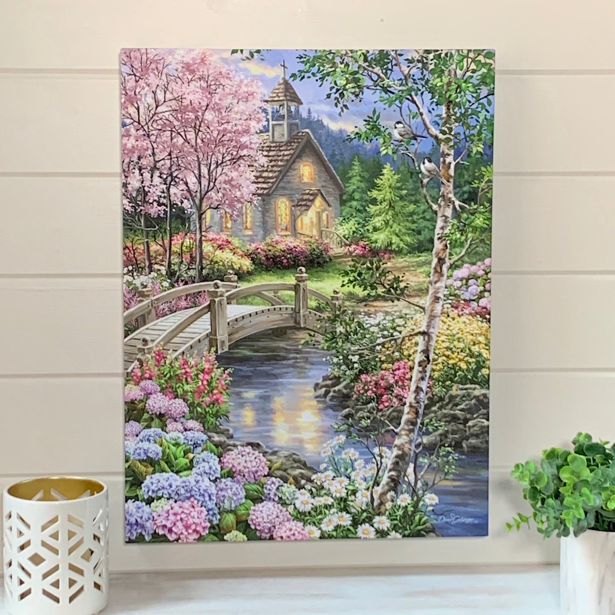  the exquisite stream that flows through this picturesque scene. Lush flowers line both sides of the stream, creating a natural pathway that leads to a charming chapel nestled in the distance.  Take in the breathtaking view of the walking bridge that spans across the stream.