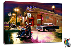This stunning piece captures the essence of freedom and adventure as a man and woman sit on a sleek motorcycle, ready to hit the open road. Parked in front of the iconic "Route 66 Grill," the muscle car and another motorcycle add to the excitement and anticipation of what lies ahead.