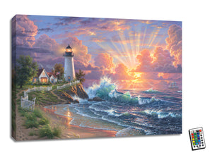 This stunning canvas captures the romantic scene of a majestic lighthouse perched atop a rugged cliff, overlooking the glistening sea. The charming house and the fluttering American flag add to the patriotic aura of the setting.  As you follow the winding trail down to the beach, you'll be mesmerized by the soothing sound of waves crashing against the shore. The setting sun streams through the clouds, creating a warm and inviting atmosphere that's sure to set your heart aflutter.