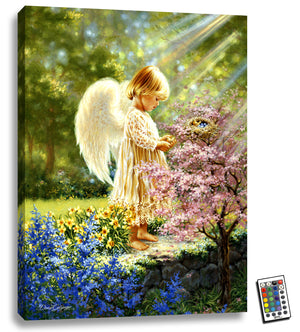  This fully illuminated LED art features a young angel in a tranquil garden, cradling a tiny baby bird in her arms with a tenderness that will melt your heart.