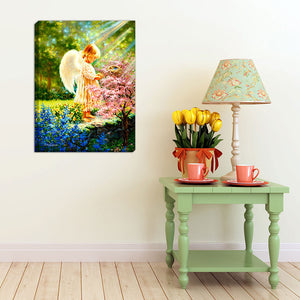 An Angel's Tenderness 18x24 Fully Illuminated LED Art. An angel in a beautiful garden staged in a bright room.