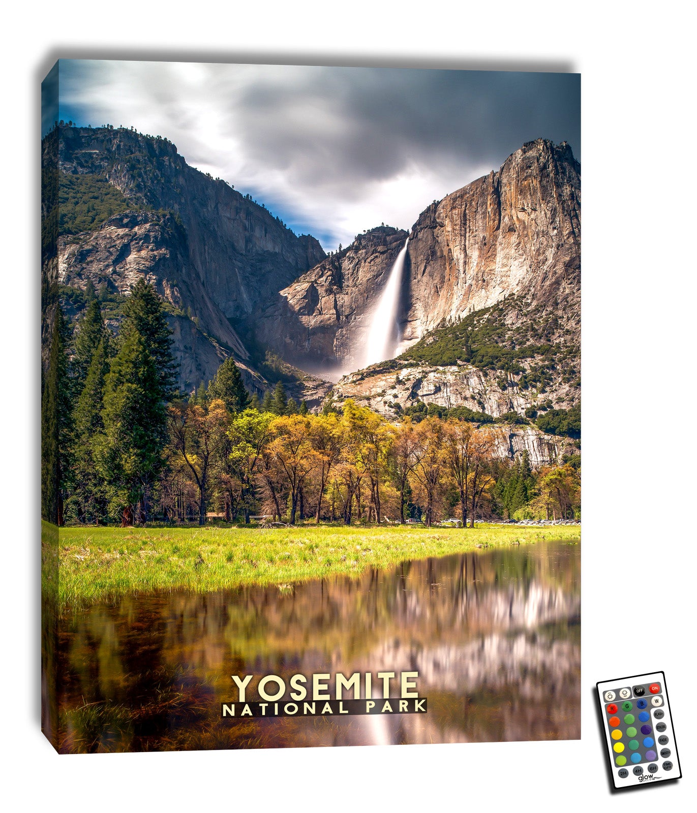  The awe-inspiring picture captures the essence of nature's magnificence as a waterfall cascades off a ledge, creating a mesmerizing spectacle. The water in the foreground perfectly reflects the stunning scene, adding an extra layer of depth and wonder.