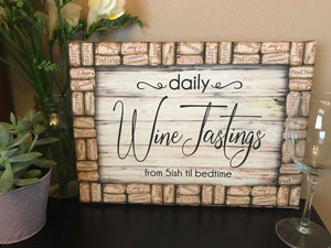  Featuring the captivating phrase "Daily Wine Tastings Daily from 5ish til bedtime", this canvas is an invitation to relax and unwind in the company of your favorite vintage.  The edge of the canvas is adorned with corks