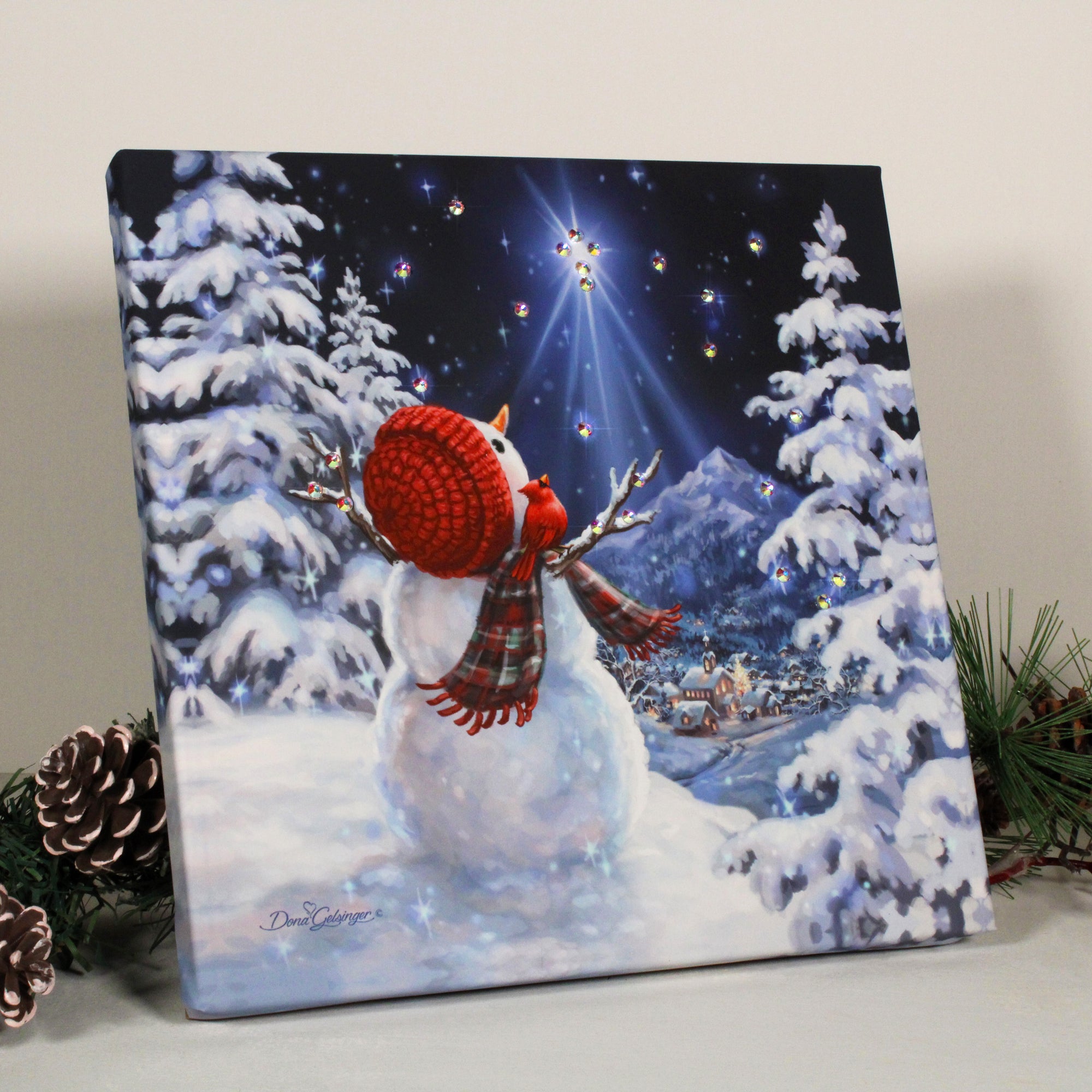 a whimsical snowman standing proudly on a snow-covered hill, gazing up at a brilliant star shining down from the heavens above. This enchanting scene is brought to life with dazzling crystals that twinkle and shine like freshly fallen snow, adding a touch of sparkle and glamour to your holiday decor.