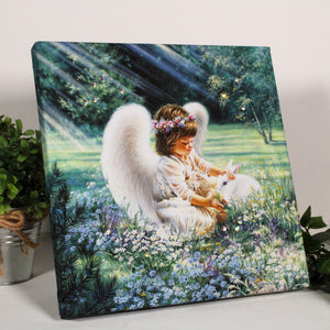 This stunning piece of art captures the essence of pure, unadulterated love with a young angel tenderly petting a bunny nestled in a bed of colorful flowers.