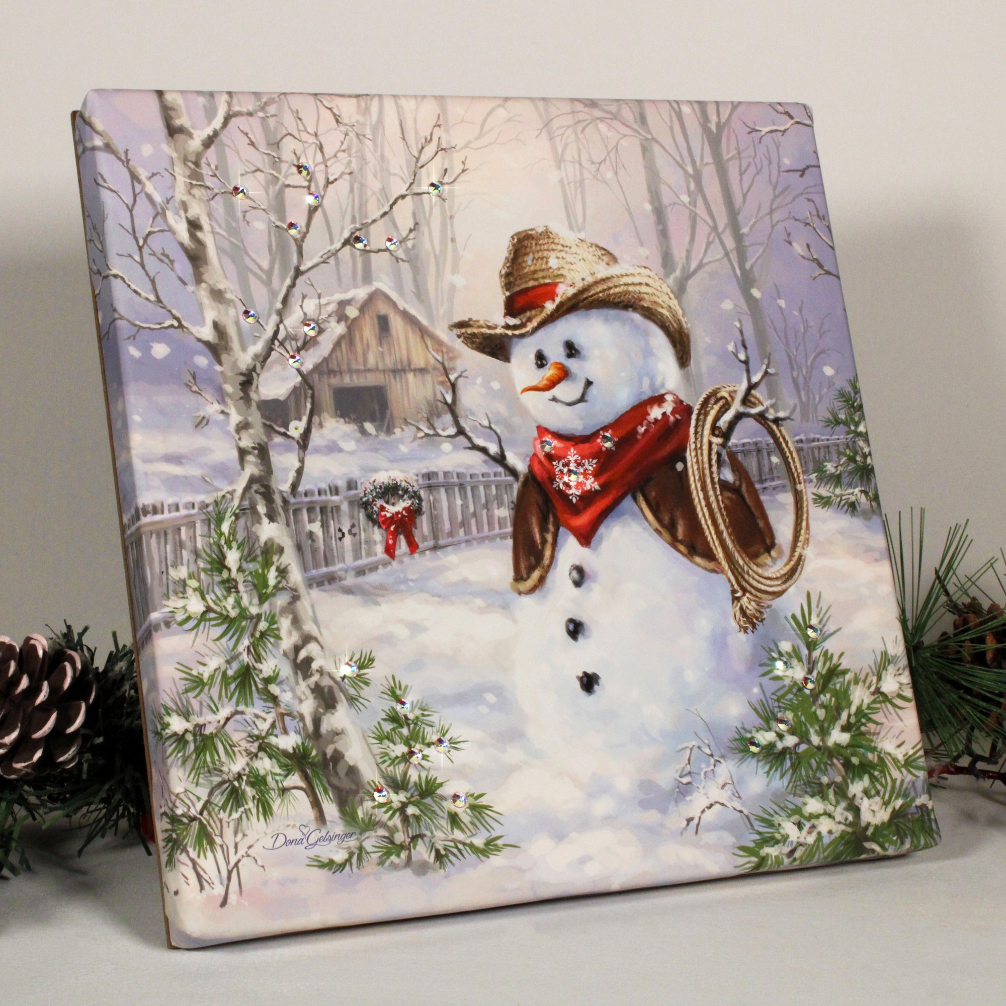 Saddle up and get ready to fall in love with Cowboy Frosty, the snowman with pizazz! This charming print captures the magic of winter and the romance of the Wild West all in one. Adorned with dazzling crystals, Cowboy Frosty brings a touch of sparkle to any space.