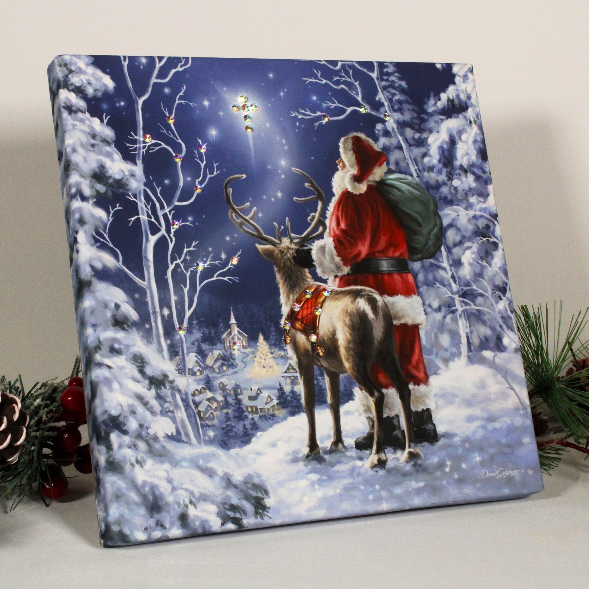 Santa stands tall and proud on a snowy ledge, dressed in his iconic red suit and carrying a sack filled to the brim with toys for all the good girls and boys.  His trusty reindeer stands nearby, ready to embark on their journey to spread joy and cheer to the small town nestled below.