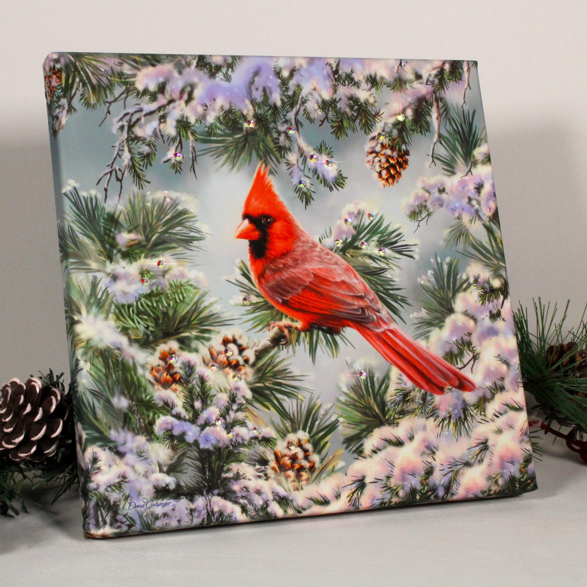 With its vibrant red cardinal perched majestically on a snow-covered pine tree, this print exudes a sense of wonder and awe. The intricate details of the small pinecones add depth and texture to the scene, creating a mesmerizing visual experience.