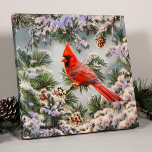 With its vibrant red cardinal perched majestically on a snow-covered pine tree, this print exudes a sense of wonder and awe. The intricate details of the small pinecones add depth and texture to the scene, creating a mesmerizing visual experience.