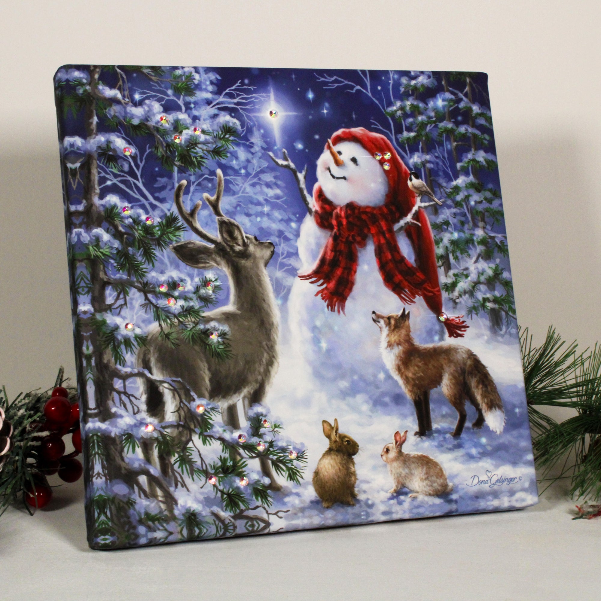 Heaven and Nature Sing Pizazz Print with Dazzling Crystals. Glistening Aurora Borealis crystals dance across the tranquil snow, reflecting the enchanting spirit of the season. A charming snowman stands tall, his jovial presence bringing joy to the wintry wonderland.