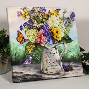  Featuring a stunning tin watering can overflowing with vibrant flowers and delicate butterflies, this print is the perfect way to add a touch of beauty to any room.  But it's not just about the visual appeal - the message behind this print is just as inspiring. With the words "The joy of the Lord is my strength" from Nehemiah 8:10 written on the can.