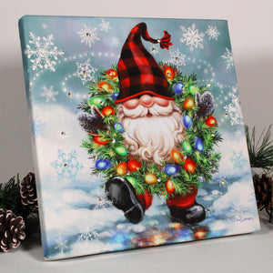 This delightful gnome, with his plaid beanie and long full white beard, is sure to capture your heart with his playful grin and mischievous twinkle in his eye.  Adorned with a brilliantly lit wreath wrapped around his neck, this enchanting gnome is the epitome of festive cheer and holiday spirit. And with dazzling crystals adorning his attire, this print exudes a magical aura that will add an extra touch of sparkle to your decor.