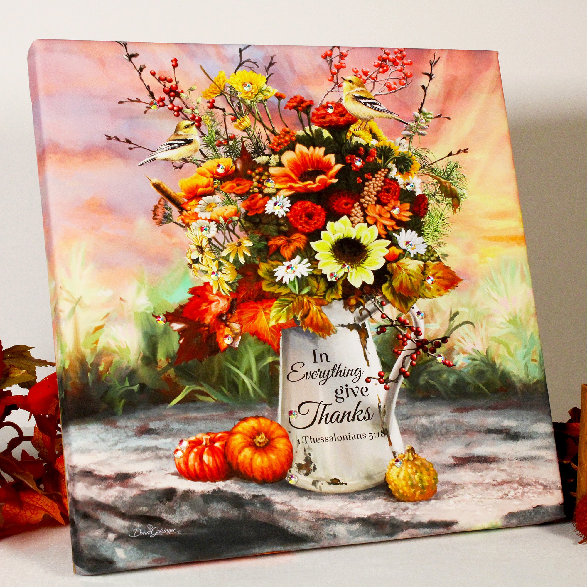This exquisite piece features an old tin watering can adorned with a stunning fall-themed bouquet, complete with vibrant hues and dazzling crystals that catch the light and make the colors pop.