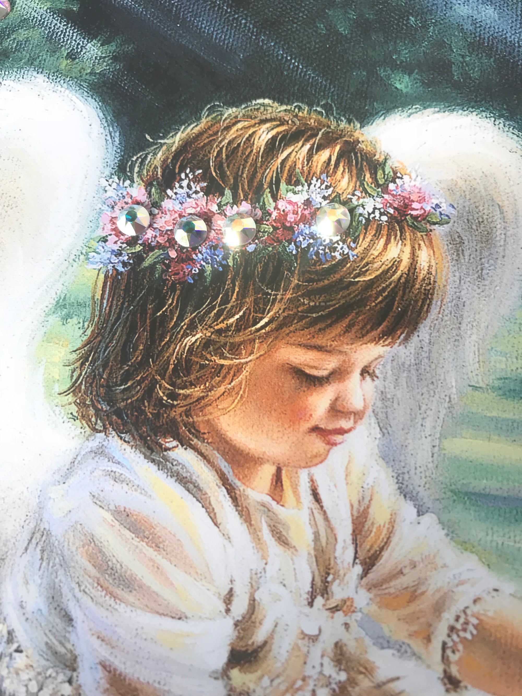 An Angel's Care Pizazz Print with Dazzling Crystals. A zoom in of the young angel