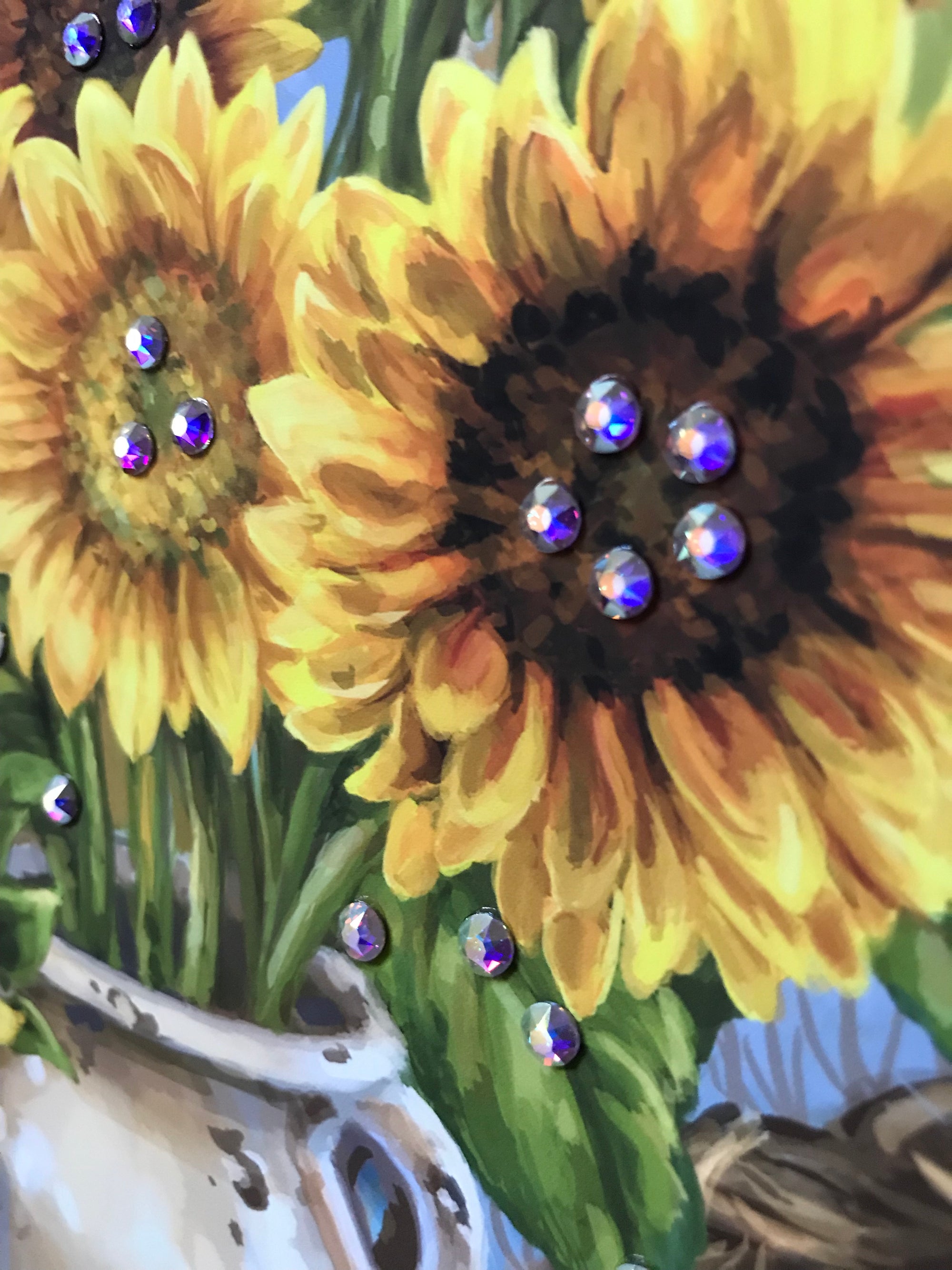  This stunning piece captures the essence of autumn with sunflowers in a charming old-fashioned milk jug and delightful pumpkins, gourds, and apples strewn about.